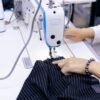 Garment maker working at a sewing machine during clothing production