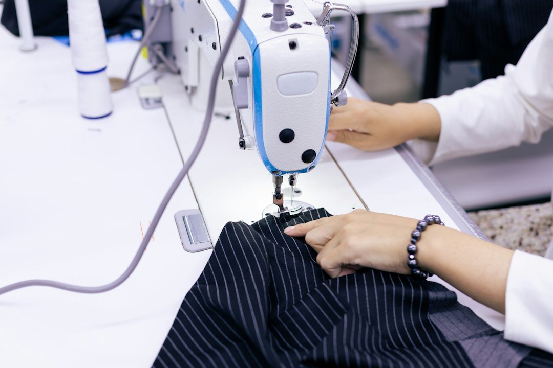 Garment maker working at a sewing machine during clothing production