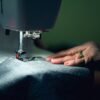 Hands-on sewing work illustrating garment workmanship and quality