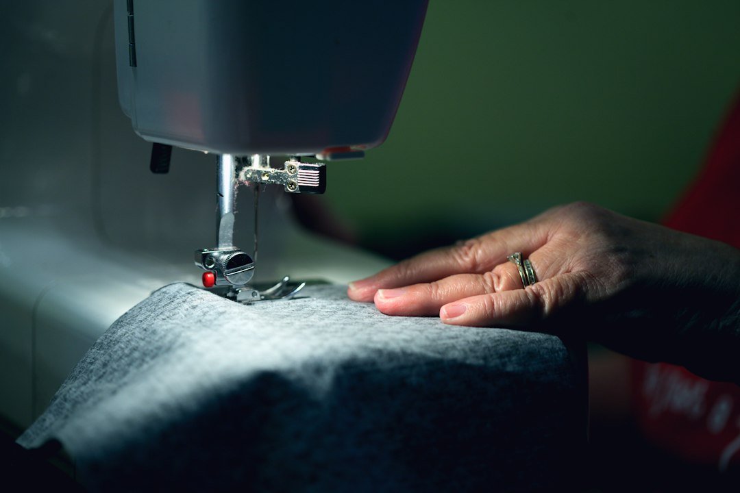 Hands-on sewing work illustrating garment workmanship and quality