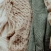 Folded wool knitwear in neutral tones for a clothing collection