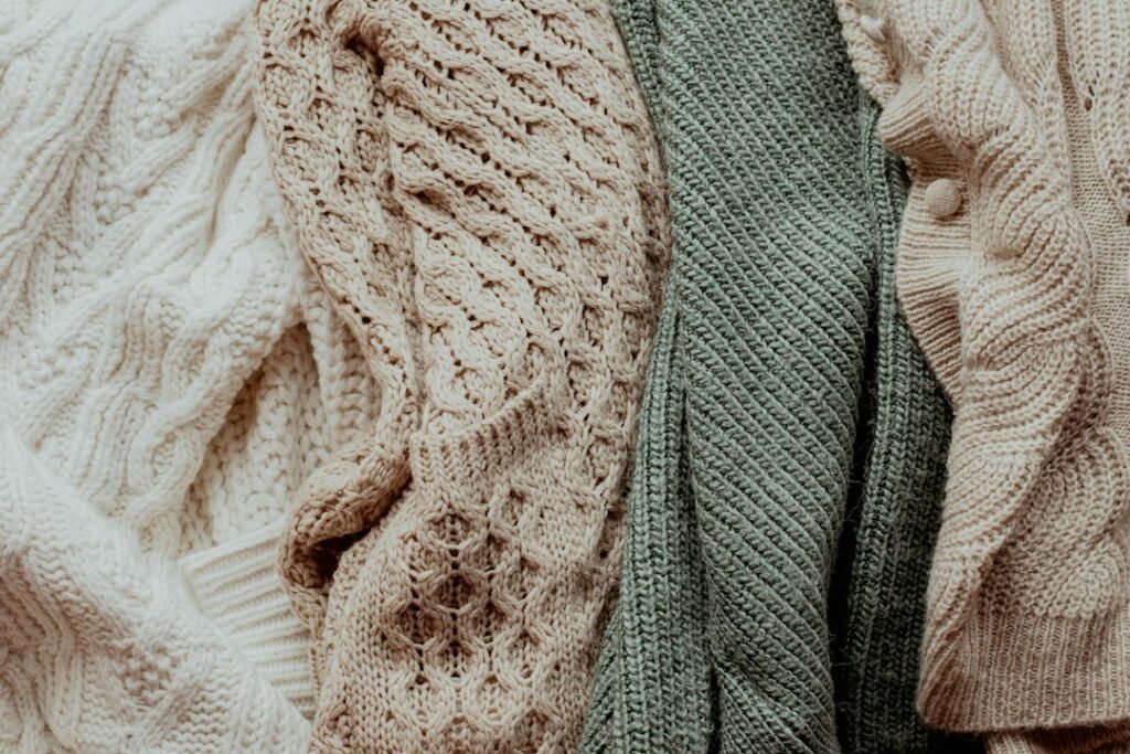 Folded wool knitwear in neutral tones for a clothing collection