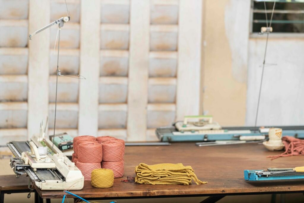 Knitting machine and textile production workspace